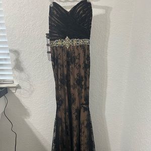 This gorgeous dress has  lace and rhinestones …Excellent Condition..